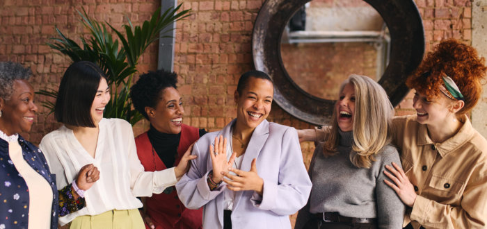 cheerful multiethnic mixed age range businesswomen