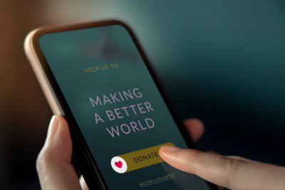 Making A Better World image with donate button on a phone screen