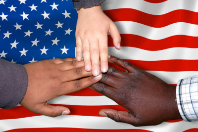 hands on top of american flag